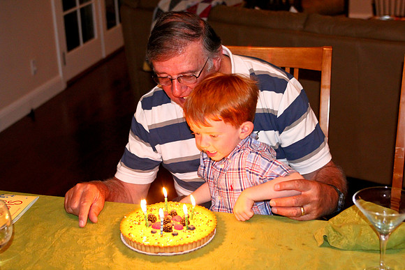 Jack helping Grandpa blow out his birthday cake-4